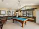 Game room with a pool table, window seating and carpeting at 12700 Grand Traverse Dr, Dade City, FL 33525