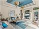 Bright living room features a unique ceiling fan, comfortable seating, and a built-in entertainment center at 12700 Grand Traverse Dr, Dade City, FL 33525