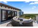 Relaxing outdoor balcony features cozy seating, views, and access to the indoors through French doors at 4902 Carranza Ct, Tampa, FL 33616