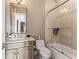 Well-lit bathroom featuring granite countertop vanity and glass-enclosed shower at 4902 Carranza Ct, Tampa, FL 33616