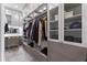 Custom walk-in closet with built-in shelving, drawers, and vanity area at 4902 Carranza Ct, Tampa, FL 33616