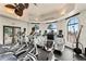 Community fitness center featuring cardio equipment, arched windows, and views of the Intracoastal Waterway at 4902 Carranza Ct, Tampa, FL 33616