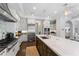 Spacious kitchen featuring a large island, stainless steel appliances, and ample storage space at 4902 Carranza Ct, Tampa, FL 33616
