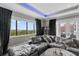 Cozy living room featuring a comfy gray sectional sofa, dark hardwood floors, and picturesque views at 4902 Carranza Ct, Tampa, FL 33616