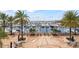 Waterfront marina with boat slips, lounge chairs, tables with umbrellas and views of the harbor at 4902 Carranza Ct, Tampa, FL 33616