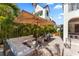 Inviting backyard patio with comfortable seating, lush foliage, and shade for relaxation at 4902 Carranza Ct, Tampa, FL 33616