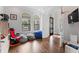 Bright playroom with large arched windows, hardwood floors, and a fun, casual atmosphere at 4902 Carranza Ct, Tampa, FL 33616