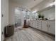 Spa-like bathroom features a walk-in shower, double vanity, and stylish tile flooring at 5709 Camila Song Ln, Tampa, FL 33625