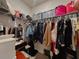 Walk-in closet with organized shelving and hanging space, providing ample storage for clothing at 5709 Camila Song Ln, Tampa, FL 33625