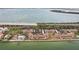 Waterfront condos with red tile roofs offer serene coastal living near a scenic causeway at 7520 Sunshine Skyway S Ln # T18, St Petersburg, FL 33711