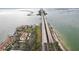Scenic aerial view of waterfront condos and a causeway offering beautiful coastal access at 7520 Sunshine Skyway S Ln # T18, St Petersburg, FL 33711