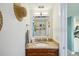 Compact bathroom featuring a mirrored cabinet with granite vanity and modern fixtures at 7520 Sunshine Skyway S Ln # T18, St Petersburg, FL 33711