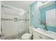 Updated bathroom features a glass enclosed tiled shower and modern vanity sink at 7520 Sunshine Skyway S Ln # T18, St Petersburg, FL 33711