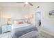 Bright bedroom featuring neutral walls, a ceiling fan, and stylish furnishings at 7520 Sunshine Skyway S Ln # T18, St Petersburg, FL 33711