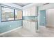 Versatile space with white cabinets, granite countertops, and ample natural light at 7520 Sunshine Skyway S Ln # T18, St Petersburg, FL 33711