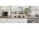 Detailed view of a kitchen sink with granite countertops, white cabinets, and modern appliances at 7520 Sunshine Skyway S Ln # T18, St Petersburg, FL 33711