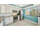 Bright kitchen featuring white cabinetry, granite countertops, and stainless steel appliances at 7520 Sunshine Skyway S Ln # T18, St Petersburg, FL 33711