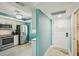 Modern kitchen adjacent to the front door, equipped with stainless steel appliances at 7520 Sunshine Skyway S Ln # T18, St Petersburg, FL 33711