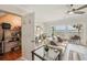 Cozy living room featuring balcony access with scenic views, and a convenient storage room at 7520 Sunshine Skyway S Ln # T18, St Petersburg, FL 33711