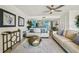 Living room featuring modern decor, two white sofas, and view to the kitchen at 7520 Sunshine Skyway S Ln # T18, St Petersburg, FL 33711