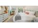 Comfortable main bedroom with chic decor, soothing colors, and an access to the private balcony at 7520 Sunshine Skyway S Ln # T18, St Petersburg, FL 33711