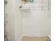Compact walk-in closet area with shelving to store clothes and accessories at 7520 Sunshine Skyway S Ln # T18, St Petersburg, FL 33711