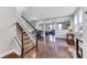 Bright and airy living room featuring hardwood floors, stairs, and modern design at 10409 Waterstone Dr, Riverview, FL 33578