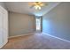 Bedroom with neutral walls and carpet with a window letting in lots of light at 18827 Duquesne Dr, Tampa, FL 33647