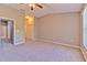 Spacious bedroom features neutral paint, plush carpet, and a ceiling fan at 18827 Duquesne Dr, Tampa, FL 33647