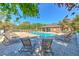 Relaxing community pool area with plenty of lounge chairs for residents to enjoy on sunny days at 18827 Duquesne Dr, Tampa, FL 33647