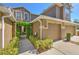 Charming home exterior featuring a lush, vine-covered entryway and a two-car garage at 18827 Duquesne Dr, Tampa, FL 33647