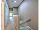 Upstairs hallway with carpet flooring and natural light at 18827 Duquesne Dr, Tampa, FL 33647