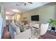 Modern living room with neutral tones, open layout, and contemporary furniture at 18827 Duquesne Dr, Tampa, FL 33647