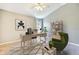 Bright office space with modern desk, shelving, and a comfortable green chair at 18827 Duquesne Dr, Tampa, FL 33647