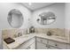 Bathroom featuring decorative tiling, mirrors and ample counterspace at 19029 Us Highway 19 N # 8-18, Clearwater, FL 33764