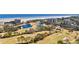 Stunning aerial view of a golf course community with lush greenery and nearby waterfront buildings at 2617 Cove Cay Dr # 604, Clearwater, FL 33760