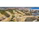 An aerial shot displaying the property's golf course, water views, and proximity to urban areas at 2617 Cove Cay Dr # 604, Clearwater, FL 33760