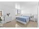Bright bedroom with light blue bedding, a dresser, and a window with a view at 2617 Cove Cay Dr # 604, Clearwater, FL 33760