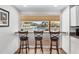 Kitchen bar with seating overlooks the beautiful pool area at 2617 Cove Cay Dr # 604, Clearwater, FL 33760