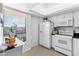 Bright, tiled kitchen features modern appliances and a large window at 2617 Cove Cay Dr # 604, Clearwater, FL 33760
