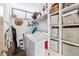 Functional laundry room with washer, dryer, shelves, and plenty of storage space at 2617 Cove Cay Dr # 604, Clearwater, FL 33760