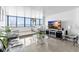 Comfortable living room featuring a water view, contemporary decor, and tile flooring at 2617 Cove Cay Dr # 604, Clearwater, FL 33760