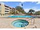 Beautiful outdoor pool and whirlpool with ample seating and resort-style amenities at 2617 Cove Cay Dr # 604, Clearwater, FL 33760