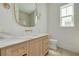 Elegant bathroom featuring marble countertops, a large mirror, and modern fixtures at 323 Appian Ne Way, St Petersburg, FL 33704