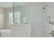Close up of the large shower with a glass surround in the primary bathroom at 323 Appian Ne Way, St Petersburg, FL 33704