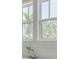A close up of bathroom windows showing the surrounding trees at 323 Appian Ne Way, St Petersburg, FL 33704