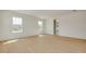 Spacious bedroom featuring lots of natural light and light-colored hardwood floors at 323 Appian Ne Way, St Petersburg, FL 33704