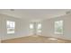 Bedroom with large windows bringing in light and hardwood floors at 323 Appian Ne Way, St Petersburg, FL 33704