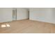 Bright, airy bedroom with beautiful light wood flooring and white walls at 323 Appian Ne Way, St Petersburg, FL 33704