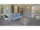 Inviting front porch with stylish seating and brick flooring provides a cozy outdoor space at 323 Appian Ne Way, St Petersburg, FL 33704